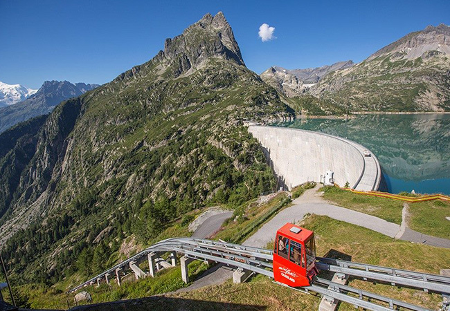 Tripadvisor Cert. of Excellence Switzerland's Best: Mountain Rail-Cars Trip to the Emosson Dam in Valais (Family Friendly) with VerticAlp EmossonRide the world's steepest double-decker funicular 2000 meters up with stunning views of Mont Blanc & the Emosson dam, and stop to trek if you want. 1h35 from Geneva, 1h20 from Lausanne
 Photo