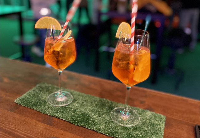4.8* on Google
Golf & Cocktails for 2 at Rollers Mini-Golf Bar (Geneva / Lausanne)
Forget ordinary bars: Rollers mixes mini-golf, cocktails & street-food bites into a great night out
 Photo